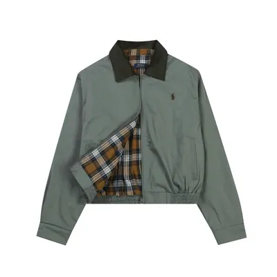 Sage-green zip jacket with a plaid lining laid flat on a white background