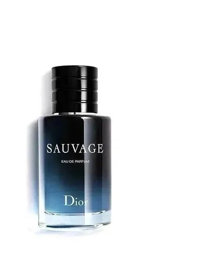 Dark blue gradient cologne bottle standing against a black backdrop