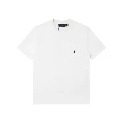 White short-sleeve polo shirt laid flat with a small embroidered chest mark